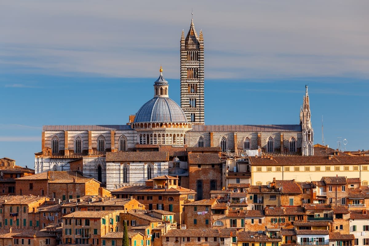Siena skyline with Gothic cathedral and medieval rooftops during an all-inclusive Tuscany tour